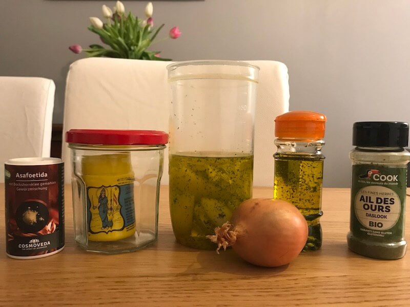homemade infused onion oil & asafeotida in a jar 